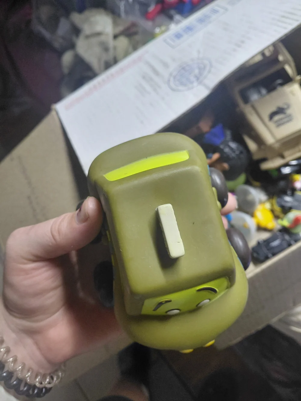 B. toys Just B You Pull-Back Taxi is a chunky olive green toy car